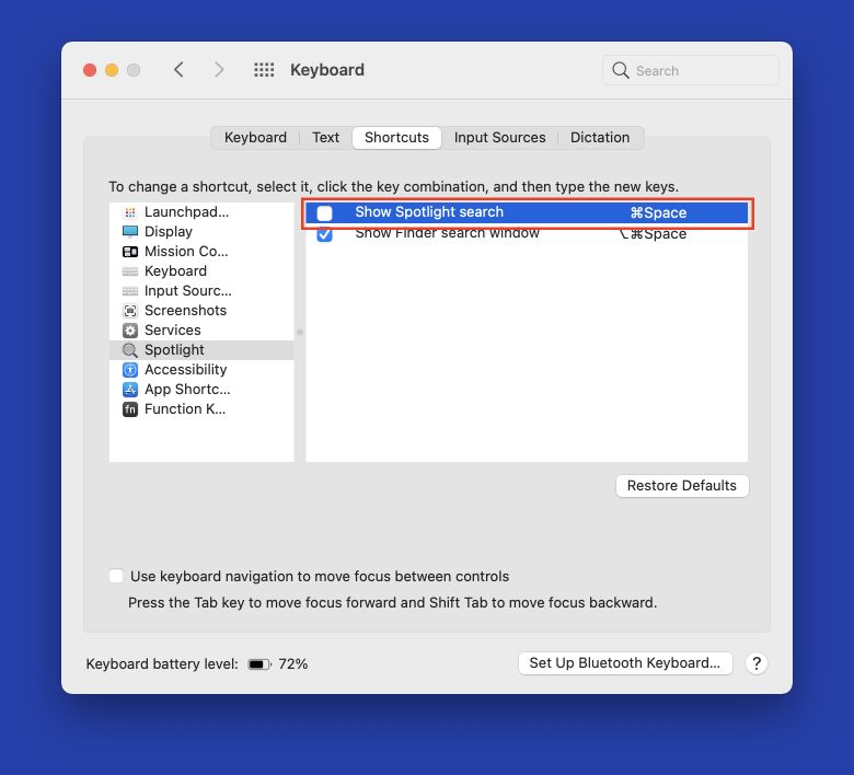 Screenshot of macOS System Settings.app. The keyboard shortcut setting for 'Show Spotlight search is highlighted.'